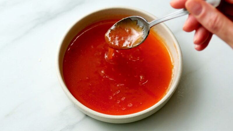 Honey Sriracha Sauce in bowl with spoon