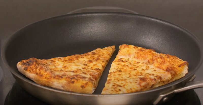 What is the best method to reheat pizza